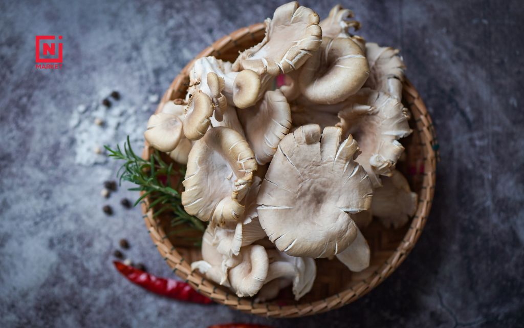 Fresh oyster mushrooms with fan-shaped caps ready for cooking