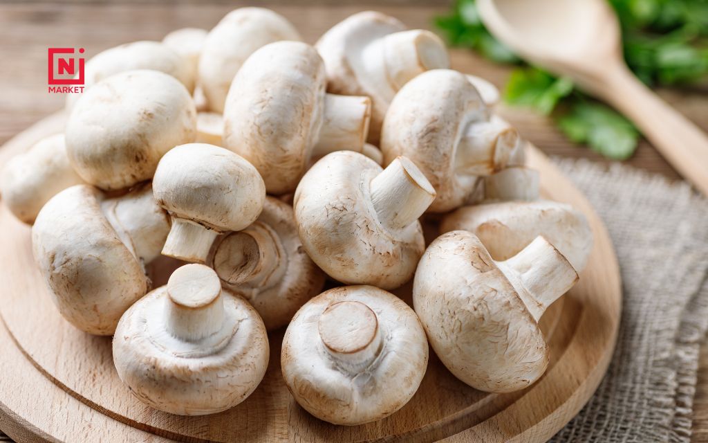 Homemade broth mushroom in a ceramic bowl with fresh thyme garnish