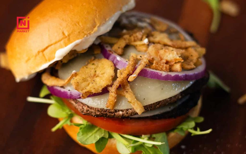 BBQ portobello mushroom burger on a toasted bun with fresh toppings