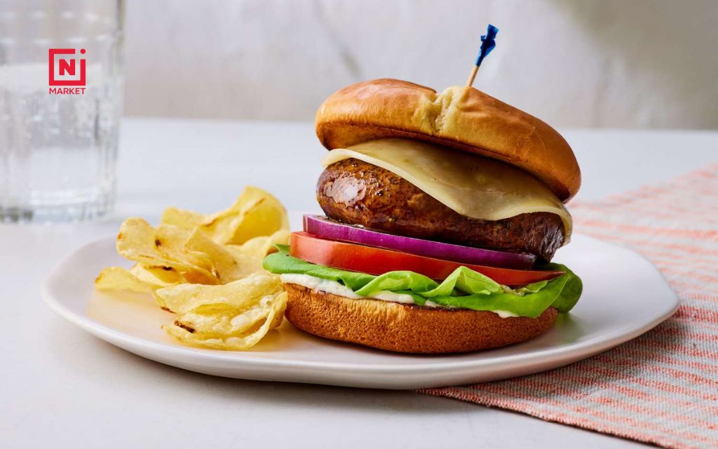 Fresh portobello mushroom caps with burger buns ready for grilling